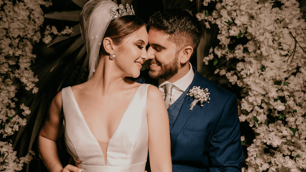 A bride and groom posing for a romantic photo