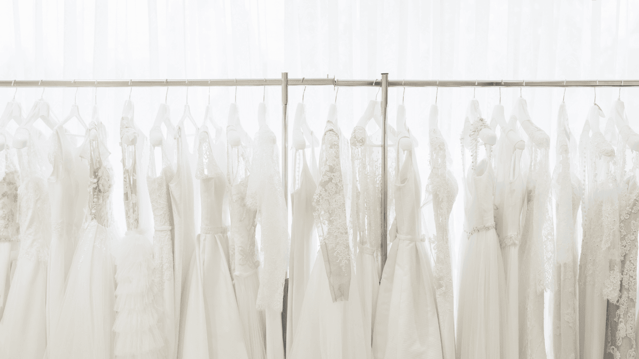wedding dresses on a rack