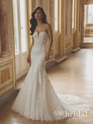 Bride in lace mermaid bridal gown with long train