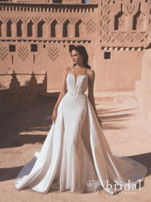 Bride in strapless wedding dress with thigh-high slit at sandstone venue