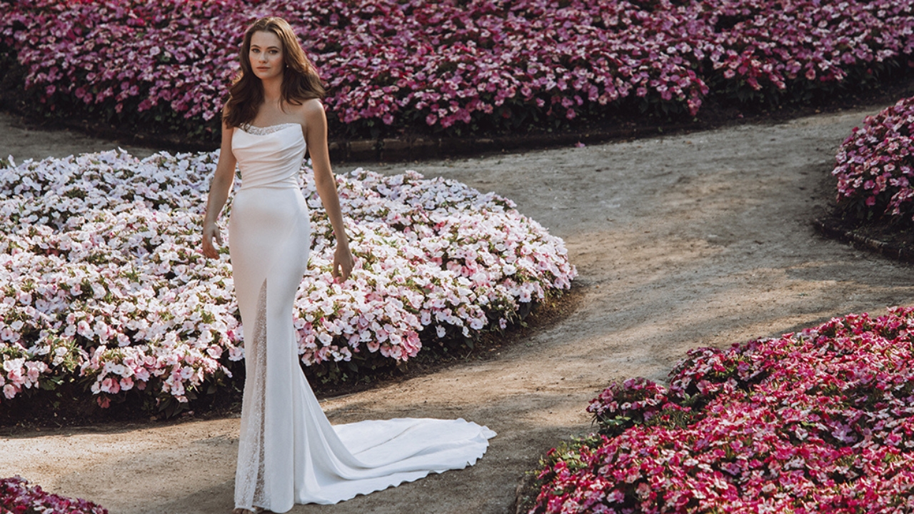White bridal gown in outdoor garden setting from Bridal Wardrobe