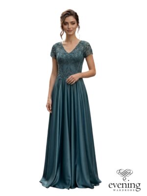 Woman wearing Style 1182, an agave green floor-length A-line evening gown with pearl and sequin lace bodice, V-neckline, sheer short sleeves and satin skirt.
