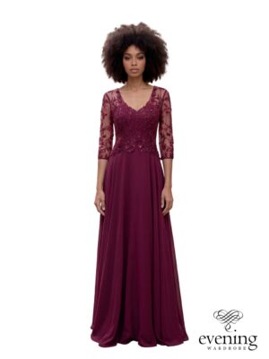 Woman wearing Style 1259 in Cabernet Red, a floor-length chiffon A-line evening gown with floral beaded bodice, V-neckline, sheer three-quarter sleeves and illusion back.