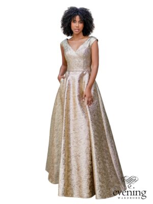 Woman wearing Style 1152, a Shining Gold metallic brocade A-line evening gown with V-neckline, cap sleeves, deep V-back and side pockets.