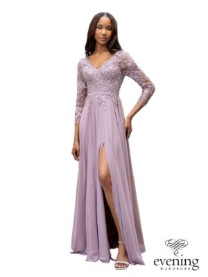 Woman wearing Style 1133 in Lavender Snow, a chiffon A-line evening gown with floral lace bodice, V-neckline, sheer three-quarter sleeves and side slit.